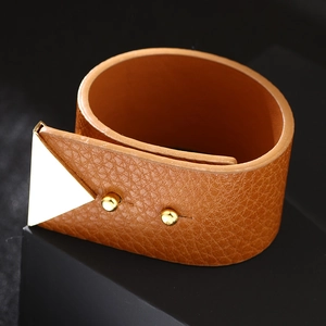 Brown textured leather wide cuff bracelet with gold triangle metal detail and studs