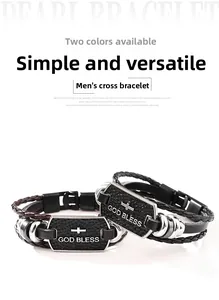 Detailed shot of braided leather bracelets with cross metal plate and God Bless engraving