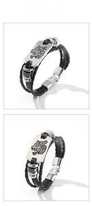Detail showing multi-layer braided leather bracelets with tiger head metal carvings in two colors