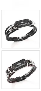 Detail showing braided leather bracelets with God Bless metal plates in black and brown