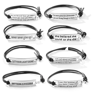 Set of eight black leather inspirational bracelets with engraved silver metal plates