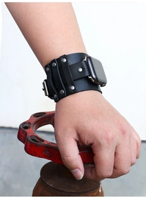 Close-up of black punk leather strap with rivets on a smartwatch for industrial style