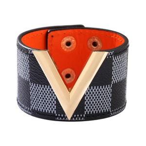Fashion wide checkerboard PU leather bracelet with gold V-shaped metal buckle on white background