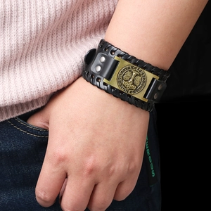 Nordic Thor's Hammer leather bracelet with bronze metal rune medallion on wrist