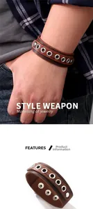 Detail of vintage brown leather wrap bracelet with silver metal eyelets and snap closure