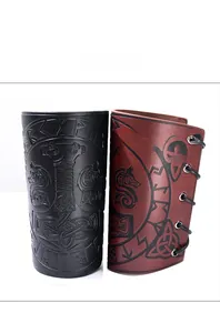 Detail of Viking faux leather arm guards with embossed Thor's hammer and rune patterns