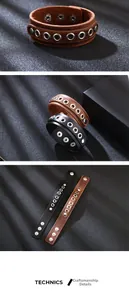 Detail of punk leather bracelet with silver metal eyelets and adjustable snap buttons