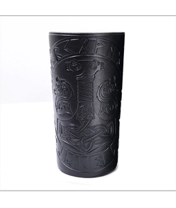 Close-up of black Viking style cup sleeve featuring embossed Mjolnir and rune patterns