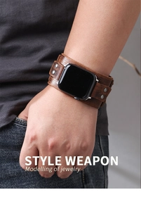 Close-up of vintage dark brown leather cuff band with silver rivets for Apple Watch