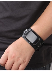Macro shot of black genuine leather cuff watch band with metal studs on a wrist