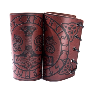 Deep red leather Viking bracers with Mjolnir engraving and adjustable black lacing