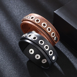Punk style leather wide bracelets in black and brown with silver metal eyelets