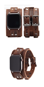 Detail of vintage brown leather strap for Apple Watch with wide cuff and silver rivets