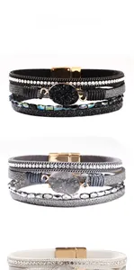 Detail of multi-layer leather bracelets with rhinestones, crystals and magnetic buckles