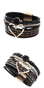 Detail of multi-layer black leather bracelet with heart charm and magnetic clasp