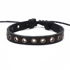 Vintage brown punk leather bracelet with bronze metal eyelets and adjustable woven cord
