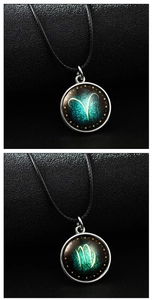 Detailed close-up of luminous zodiac pendants with Aries and Virgo symbols on black leather