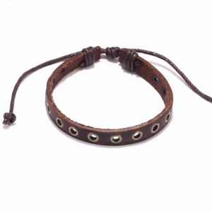 Vintage brown leather punk bracelet with brass eyelets and adjustable braided cord closure