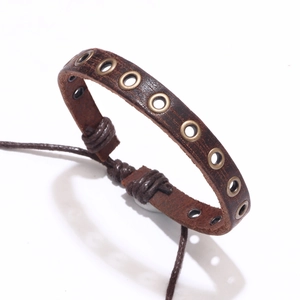 Retro brown leather bracelet with bronze metal eyelets and adjustable braided cord tie