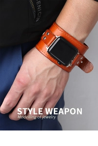 Detail view of vintage brown leather strap with silver rivets for Apple Watch