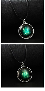 Detailed close-up of luminous zodiac necklaces with Scorpio and Libra glass pendants