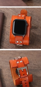 Macro detail of orange-brown leather cuff strap for Apple Watch with silver buckle