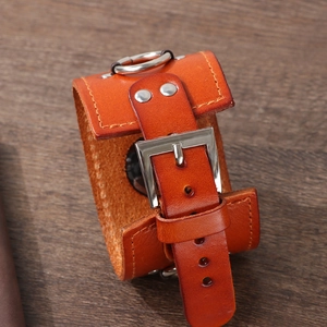 Retro genuine leather strap for iWatch in brown orange with silver buckle on wood background