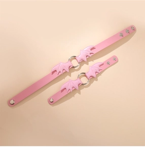 Pink PU leather choker and bracelet set with bat wings and metal rings in gothic style