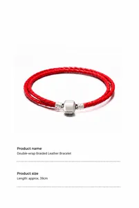 Detail of red double-wrap braided leather bracelet with silver cylindrical metal clasp