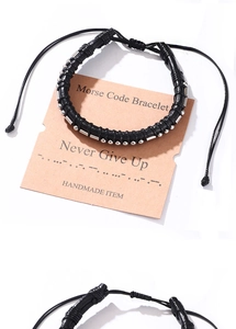 Detail of adjustable Morse Code bracelet with silver beads on a Never Give Up card