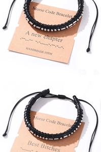 Detail of hand-woven leather Morse code bracelet with silver beads on a display card