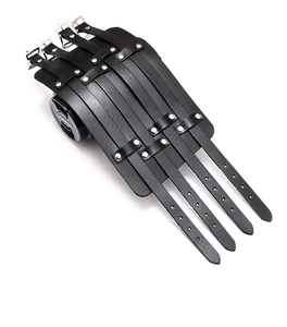Detail of multi-layered black leather cuff with four adjustable silver buckles and studs