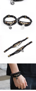 Detail of Yin Yang braided leather bracelets with wooden beads and metal snap buttons