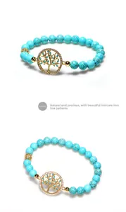Détail des perles de turquoise et pendentif arbre de vie doré avec cristaux