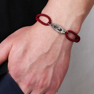 Adjustable red braided rope bracelet with polished stainless steel handcuff clasp charm