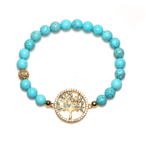 Bracelet en perles de turquoise avec pendentif arbre de vie doré et zircons scintillants