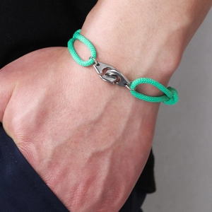 Adjustable green braided rope bracelet with silver stainless steel handcuff clasp
