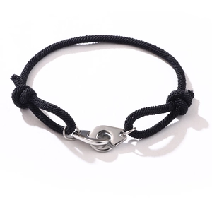 Adjustable black braided rope bracelet with polished silver stainless steel handcuff clasp