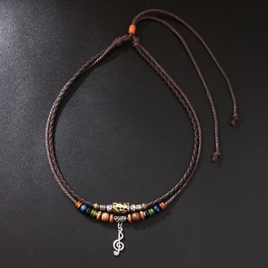 Retro beaded necklace with musical note pendant and wooden beads on black background