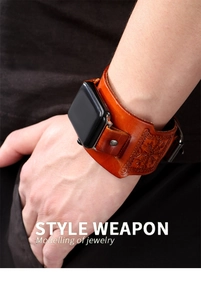 Detail of brown leather wide wristband for Apple Watch with embossed compass and studs