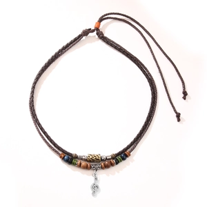 Vintage braided wooden bead necklace with a retro treble clef music note pendant