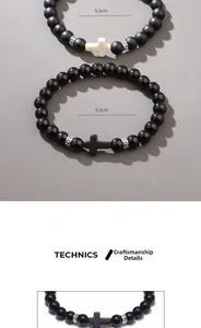 Detail of matte obsidian beads and cross pendant on a handmade braided bracelet