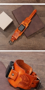 Macro detail of vintage eagle totem embossed leather watch strap with rustic metal rivets
