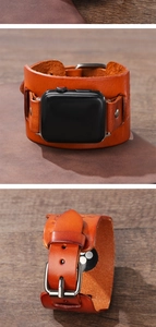 Detail of vintage orange-brown leather cuff watch band with silver rivets for Apple Watch