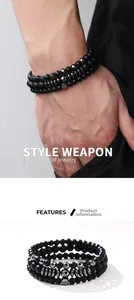 Close-up of three-piece men's beaded bracelet set featuring matte black and hematite beads
