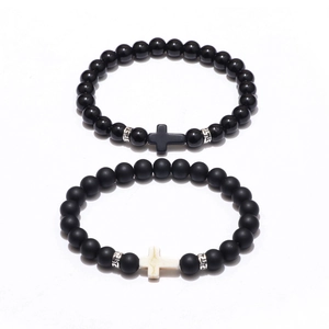 Matte obsidian and glossy black beaded cross bracelets set with Greek pattern spacers