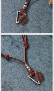 Macro shot of brown leather necklace featuring a vintage triangular metal ring pendant