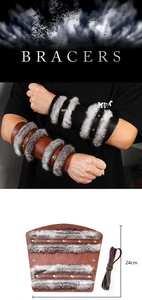 Detail of Viking faux leather bracers with rabbit fur trim and brass rivets, 24cm height