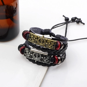Vintage braided leather bracelets with bronze anchor and silver helm nautical charms