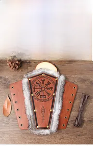 Detail of Viking Vegvisir bracer with brown leather, gray faux fur, and metal rivets